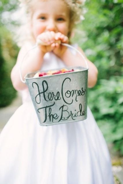 a bucket with calligraphy is a cool and easy idea for a rustic wedding