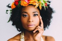 you may highlight your curls with a colorful floral crown, which is a trendy idea