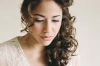 a side half updo with curls and bangs is a chic and very girlish idea of a wedding hairstyle