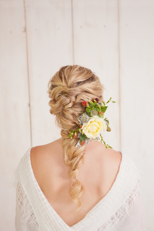 a voluminous curly twisted braid is great for relaxed and boho chic bridal styles