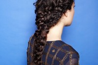 a curly long braids coming into a single braid is a whimsy and very boho chic idea