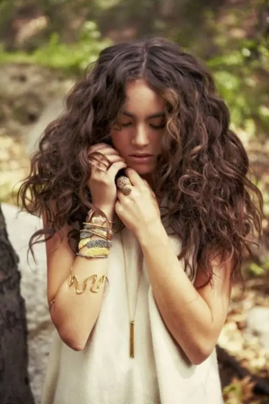 a bush of curly hair will perfectly fit a boho chic or a gypsy-inspired bridal look