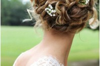 raise your curly hair into a comfy and chic updo and add some fresh blooms