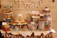 a bright and fun Disney-themed dessert table with quotes, book pages and figurines