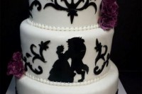 a black and white The Beauty and The Beast wedding cake with purple blooms and beads on each layer