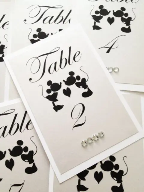 black and white Mickey and Minne table numbers with rhinestones are a cute and simple stationery idea