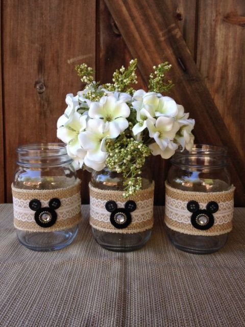 jars wrapped with burlap and lace plus large buttons that make up Mickey Mouse heads