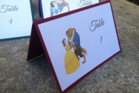 the Beauty and the Beast wedding table numbers are a fun idea for a Disney-themed wedding