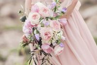 a beautiful and chic rose quartz wedding bouquet of peony roses and some cascading greenery is a beautiful idea to rock
