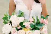 a beautiful wedding bouquet of peachy, blush and mustard blooms and several types of greenery is a lovely idea for summer