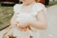a boho lace maxi flower girl dress with ruffled cap sleeves and a square cut