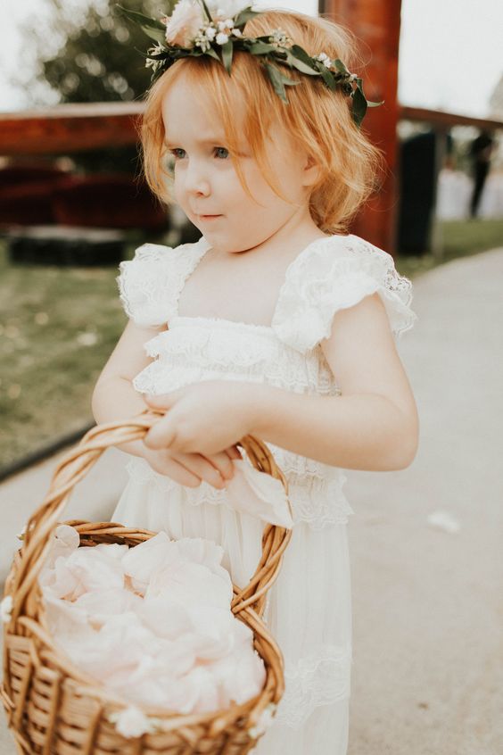 a boho lace maxi flower girl dress with ruffled cap sleeves and a square cut