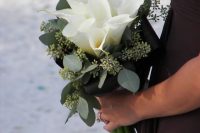 a bridesmaid bouquet of white callas and eucalyptus is a lovely idea for a sophisticated wedding