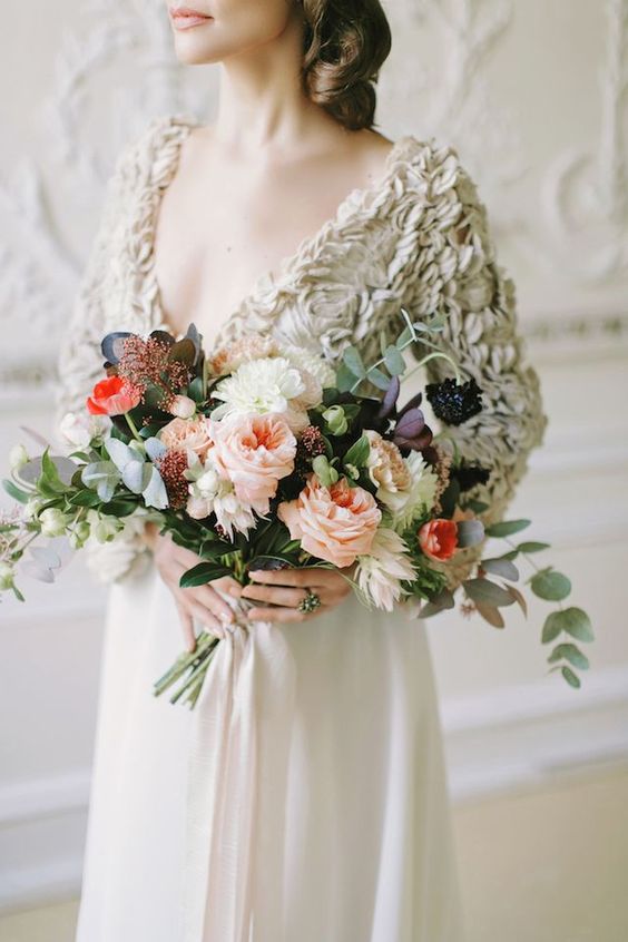 a contrasting wedding bouquet with white and pink quartz blooms, bold coral and dark foliage plus some berries is amazing for the fall