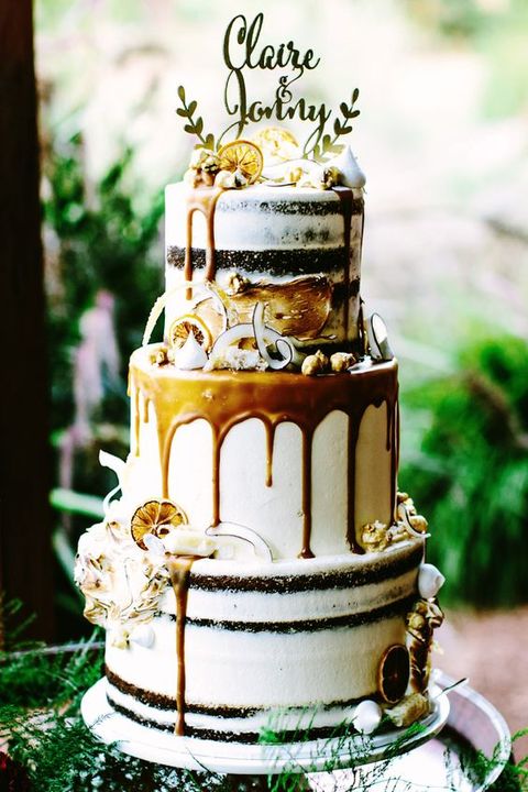 a gorgeous fall boho wedding cake with caramel drip, candied lemon and shaved coconut plus an elegant topper