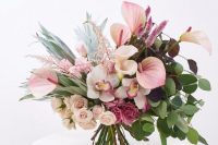 a gorgeous wedding bouquet of callas, roses, carnations, lots of greenery and some pretty textural fillers