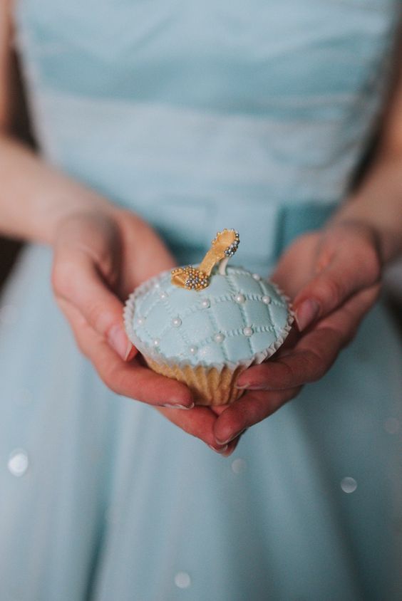 a little blue cupcake with a shoe is an ideal dessert for a Cinderella themed wedding