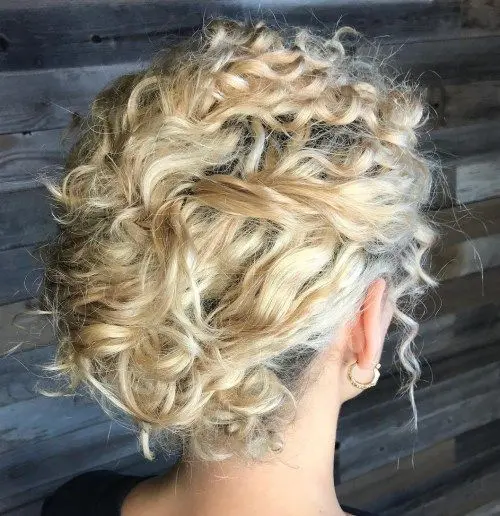 a messy blonde updo with bangs won't take much time or effort and will fit many bridal styles