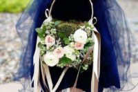 a moss basket decorated with lush florals and berries plus blush ribbon accents is a very chic idea