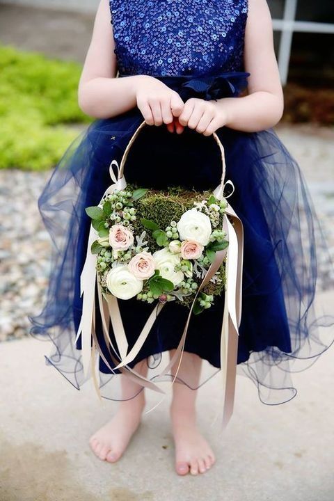 a moss basket decorated with lush florals and berries plus blush ribbon accents is a very chic idea