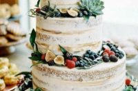 a naked wedding cake with figs, berries of all kinds, greenery and succulents is amazing for a bright summer wedding