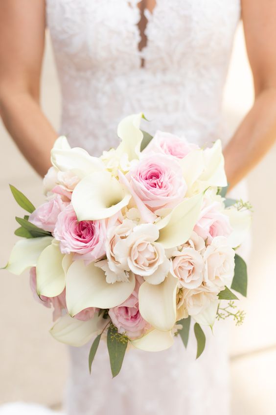 a pink and blush rose and white calla wedding bouquet is a sweet and lovely idea for a wedding