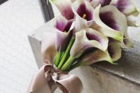 a purple calla lily wedding bouquet with a dusty pink ribbon bow is a classic idea with a touch of color