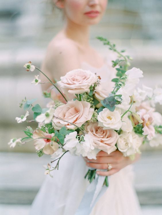 a refined dimensional wedding bouquet with blush roses, some white blooms and greenery is an amazing idea for spring