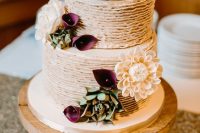 a tiered ruffle wedding cake with deep purple callas, succulents and neutral dahlias is a lovely idea for a fall wedding