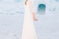 an Elsa-inspired bridal look with a white lace fitting dress and an Elsa’s braid