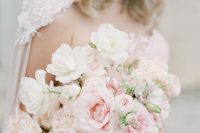 an ethereal rose quartz wedding bouquet with some white blooms, too, is a beautiful idea in candy shades