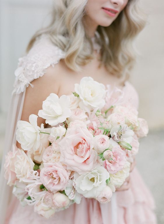 an ethereal rose quartz wedding bouquet with some white blooms, too, is a beautiful idea in candy shades