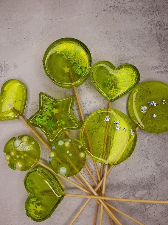 bold lime clear round, star-shaped and heart-shaped lollipops with edible beads and stars are great for summer