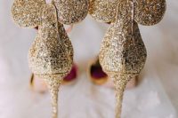 gold glitter Mickey Mouse ears wedding shoes is a very whimsy and fun idea for a Disney bride