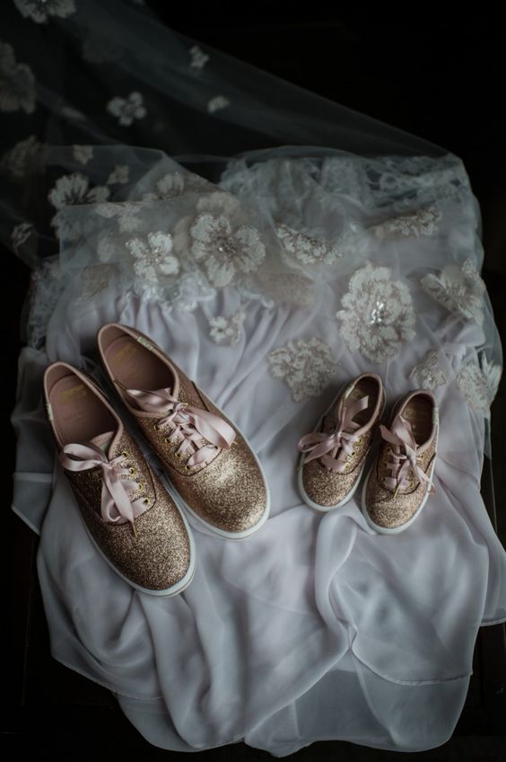 gold glitter sneakets with pink laces are a glam and cute idea for a little flower girl