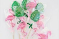 monstera leaves and pink flamingo lollipops are perfect to give them as tropical wedding favors