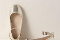 silver ankle strap flat shoes are a shiny touch to the flower girl’s look