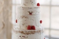 a naked wedding cake decorated with fresh strawberries for a bold contrast will easily fit any wedding