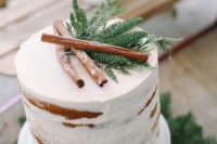 a naked wedding cake topped with fir and cinnamon sticks is ideal for a winter or Christmas wedding