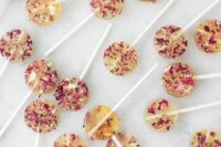tiny clear lollipops with rose petals are amazing for any wedding, and they are easy to make yourself