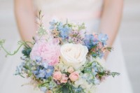 a lovely small wedding bouquet of neutral, serenity blue and light pink blooms and some greenery is a gorgeous idea for a wedding in pastel colors