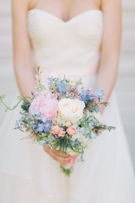 a lovely small wedding bouquet of neutral, serenity blue and light pink blooms and some greenery is a gorgeous idea for a wedding in pastel colors
