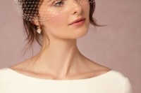 a classic birdcage veil will bring a cool refined touch to the look and make it more beautiful and chic