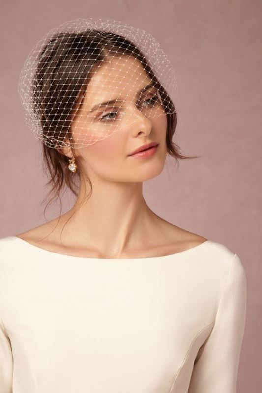 a classic birdcage veil will bring a cool refined touch to the look and make it more beautiful and chic