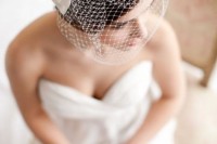 a birdcage veil with a bow is a classic vintage idea of a headpiece that will bring a lovely touch to your look