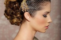 a birdcage veil attached to the head with embellished gold hairpieces is a sophisticated and chic idea to rock