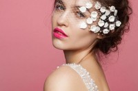 a mini veil placed on the face, with floral appliques on one side is a statement and bold accessory to rock