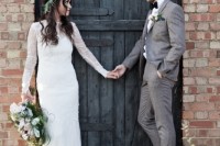 a chic barn groom’s outfit with a grey suit, a white button down, brown shoes and a black bow tie