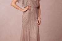 a dusty pink embellished and embroidered maxi dress with short sleeves, a high neckline