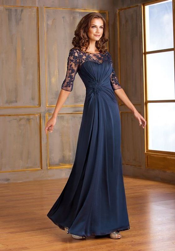 a navy A-line gown with a draped and lace bodice, long sleeves and a draped skirt for the mother of the bride
